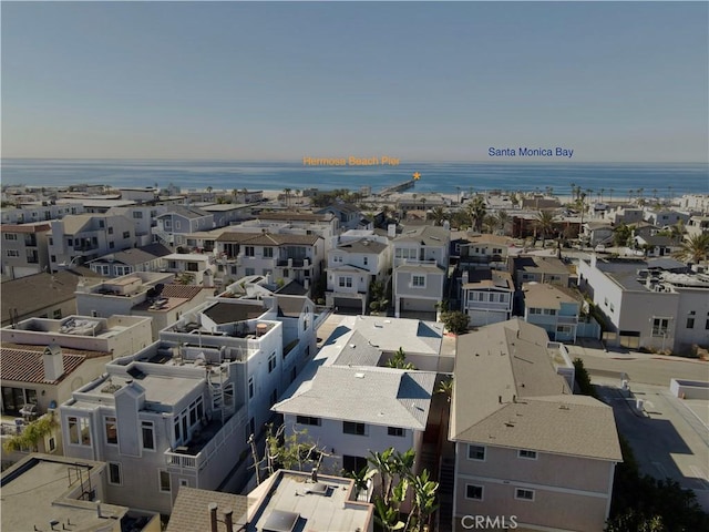 aerial view with a water view and a residential view