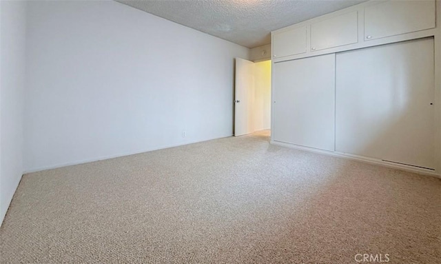 unfurnished bedroom with a closet and a textured ceiling