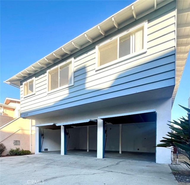 view of home's exterior with driveway