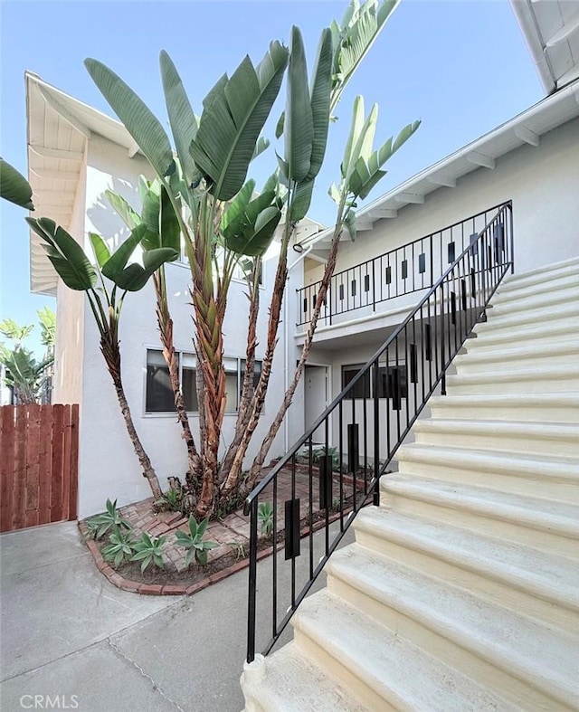 view of property featuring stairs