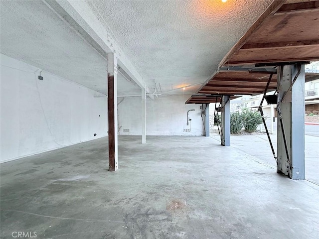 basement with a textured ceiling