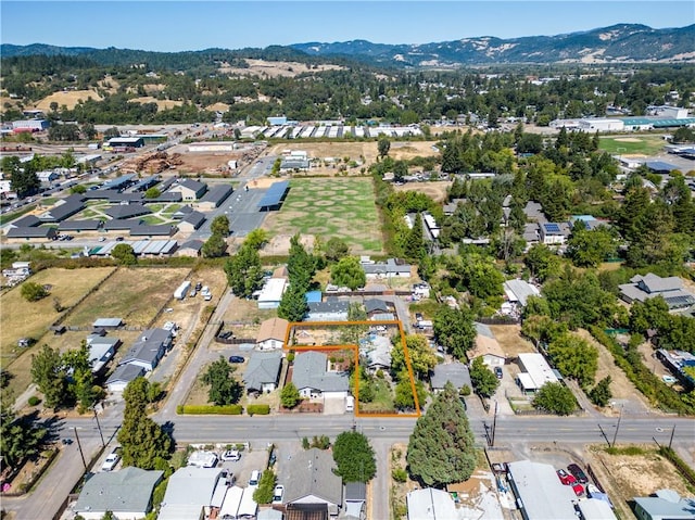 birds eye view of property featuring a mountain view