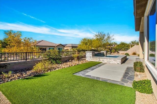 view of yard featuring a hot tub and a patio area