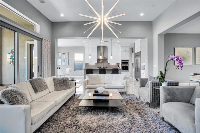 living room featuring an inviting chandelier and sink