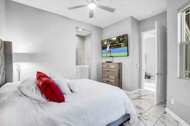 bedroom featuring ceiling fan and ensuite bathroom