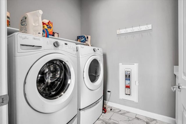 laundry room featuring separate washer and dryer