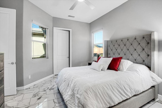 bedroom with ceiling fan and a closet