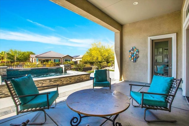 view of patio featuring a fenced in pool