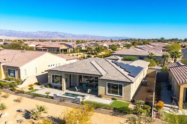 birds eye view of property with a mountain view