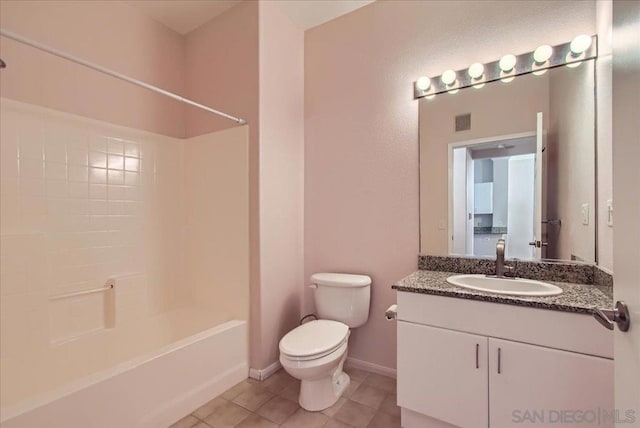 full bathroom featuring toilet, vanity,  shower combination, and tile patterned flooring