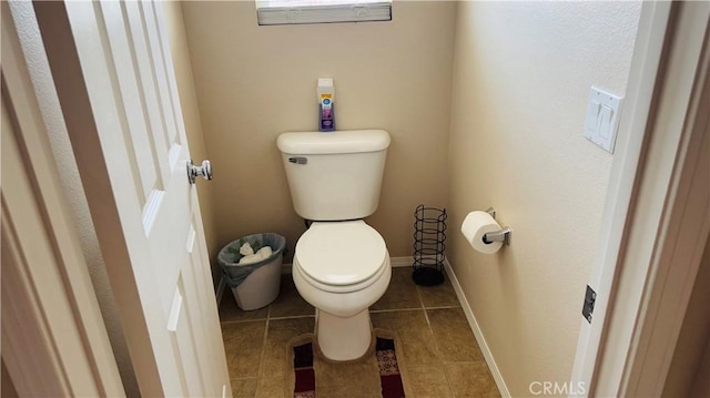 bathroom with tile patterned floors and toilet