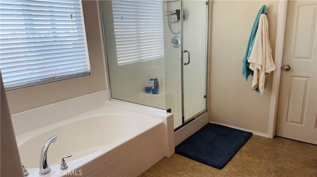 bathroom with tile patterned floors and plus walk in shower