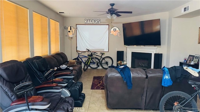 tiled living room featuring ceiling fan