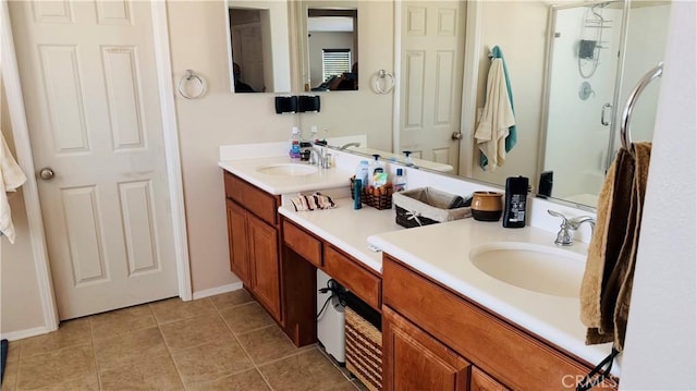 bathroom featuring tile patterned flooring, vanity, and walk in shower