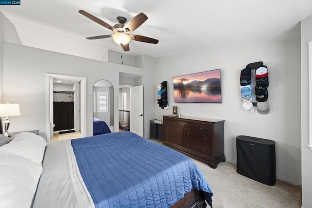 carpeted bedroom featuring vaulted ceiling and ceiling fan