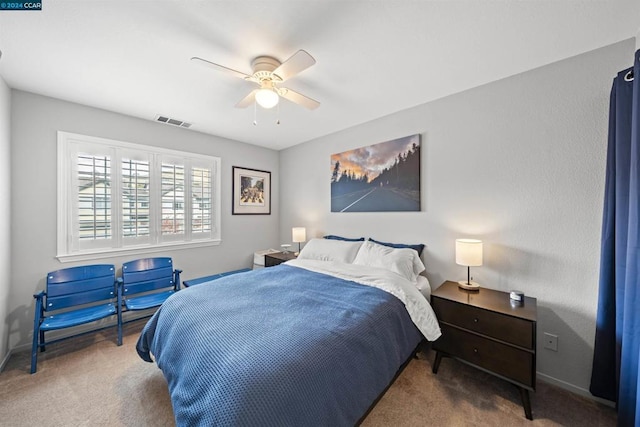 bedroom with ceiling fan and carpet flooring