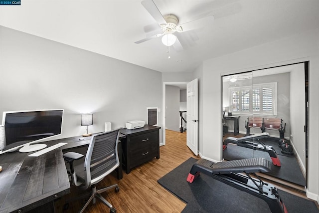 office space featuring ceiling fan and light hardwood / wood-style floors