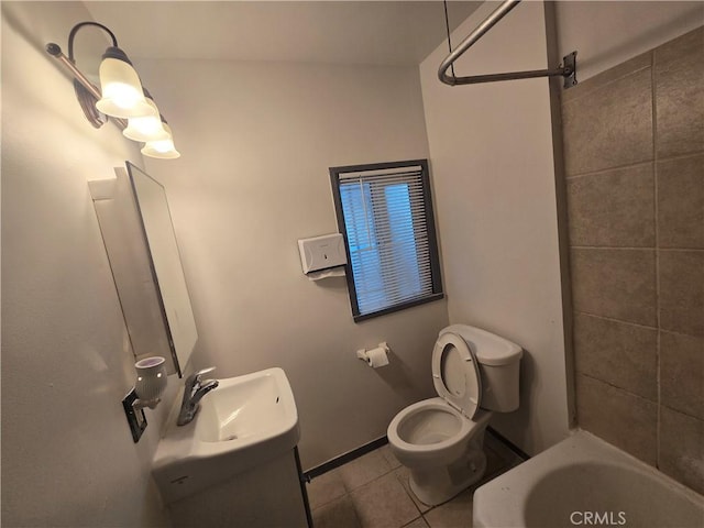 bathroom with tile patterned floors, vanity, and toilet