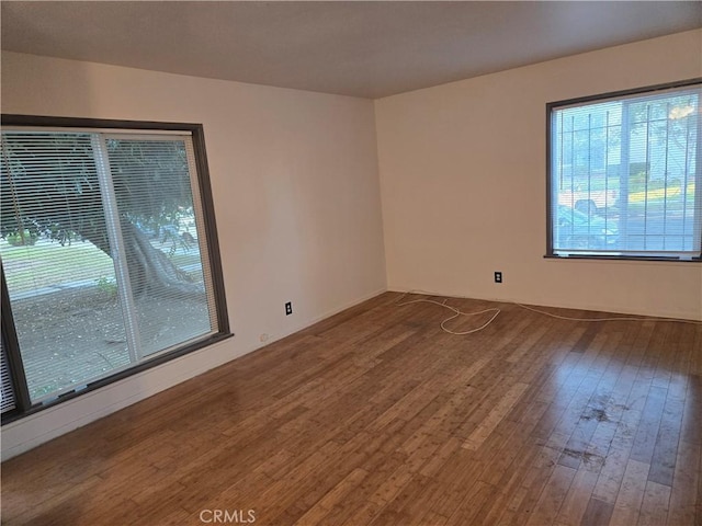 empty room featuring wood-type flooring