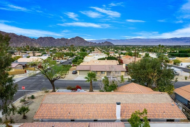 birds eye view of property with a mountain view