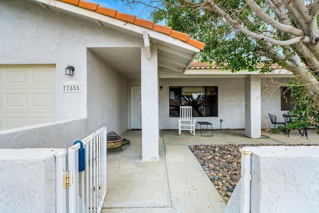 property entrance featuring a garage