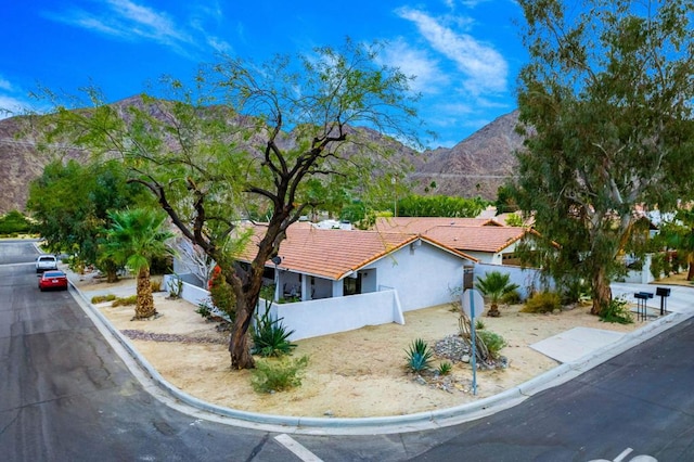 view of front of property with a mountain view