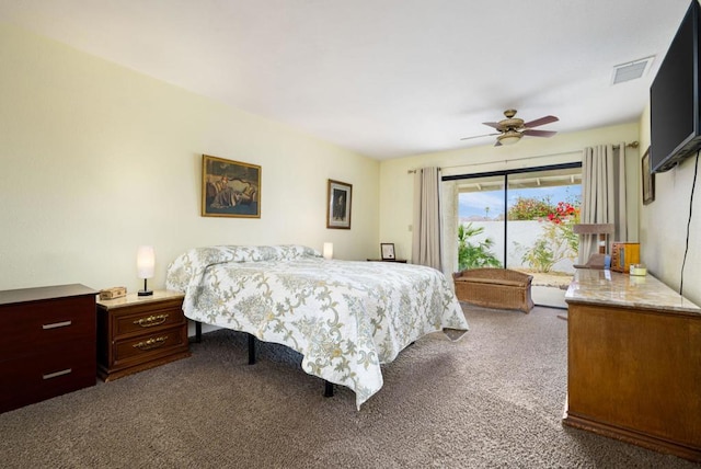 bedroom with dark colored carpet and ceiling fan