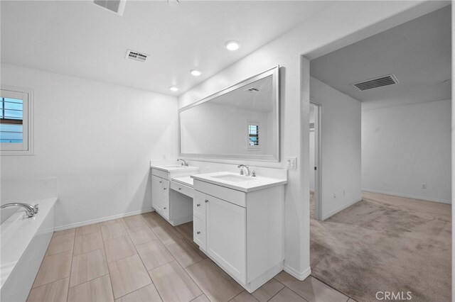 5418 Heitz Way, Fontana, CA 92336 - full bath with double vanity, a bath, and recessed lighting