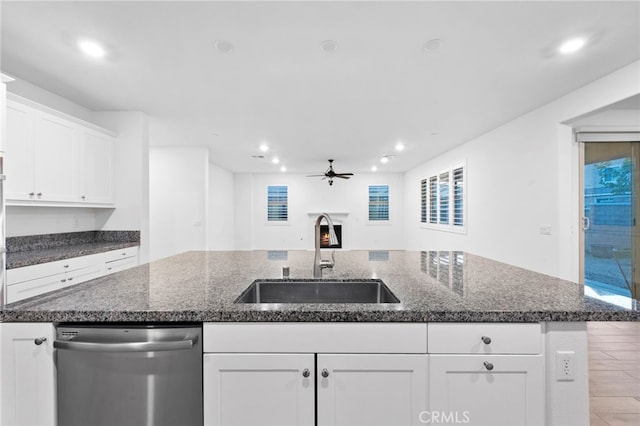 5418 Heitz Way, Fontana, CA 92336 - kitchen with stainless steel dishwasher, ceiling fan, recessed lighting, white cabinetry, and an island with sink