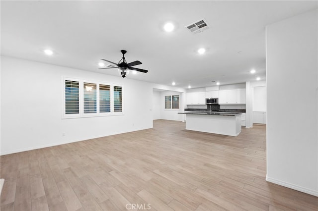 5418 Heitz Way, Fontana, CA 92336 - unfurnished living room featuring recessed lighting, a ceiling fan, and light wood finished floors