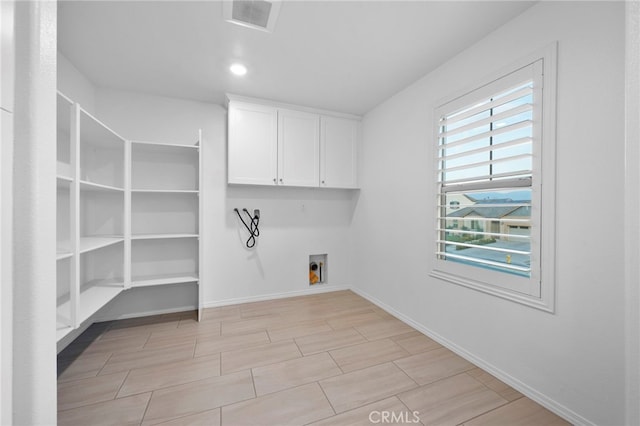 laundry area with washer hookup, hookup for an electric dryer, and cabinets