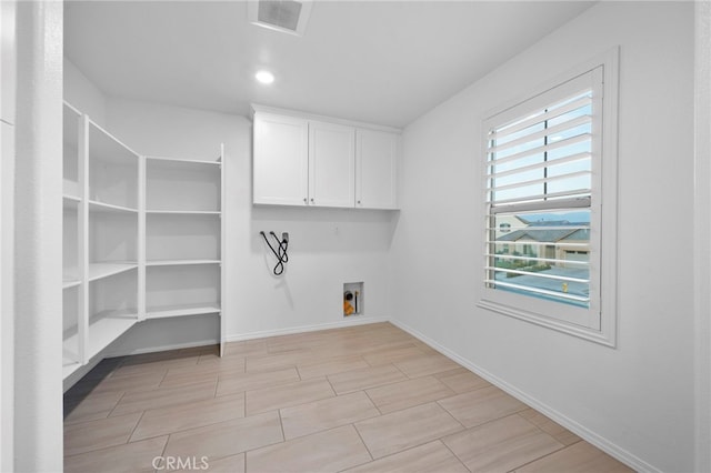 5418 Heitz Way, Fontana, CA 92336 - laundry area with washer hookup, cabinet space, and wood tiled floors