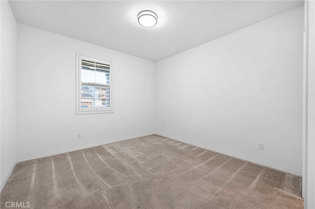 spare room with light carpet