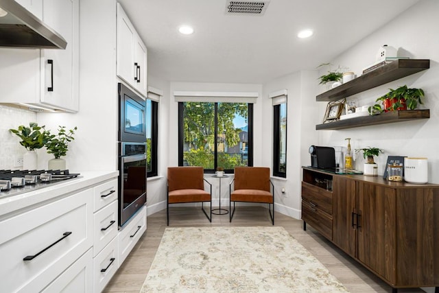 living area featuring light hardwood / wood-style floors