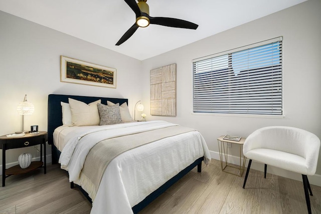 bedroom with hardwood / wood-style floors and ceiling fan