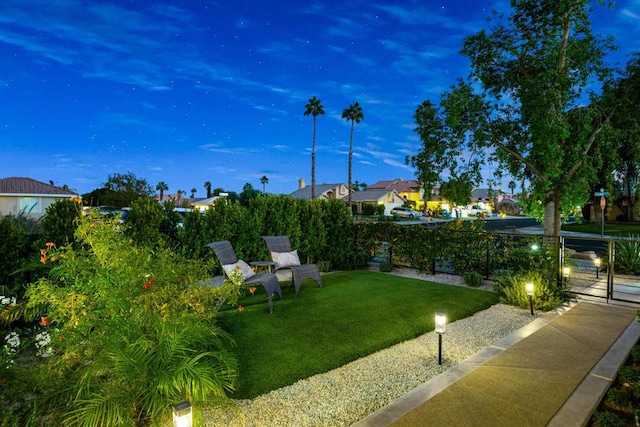 view of yard at dusk