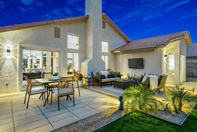 back of house with a patio area and an outdoor hangout area