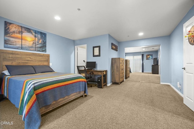 carpeted bedroom featuring recessed lighting and baseboards