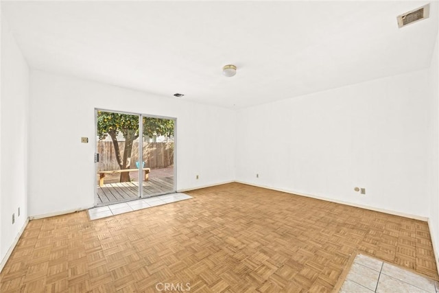 unfurnished room featuring light parquet flooring