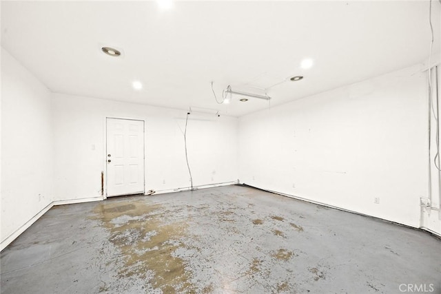 unfurnished room featuring concrete flooring