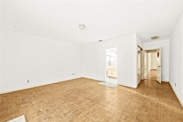 unfurnished room with light parquet floors