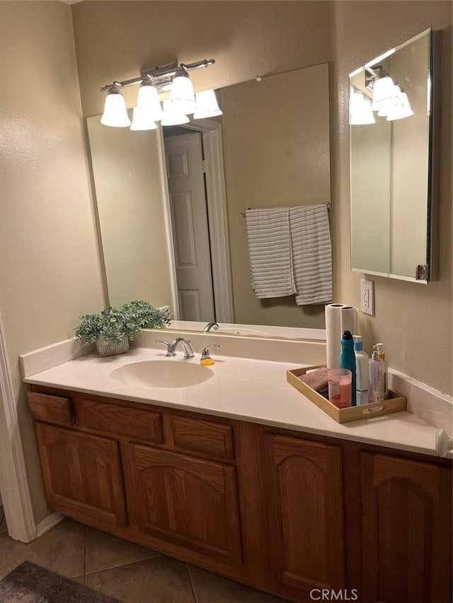 bathroom with tile patterned floors and vanity