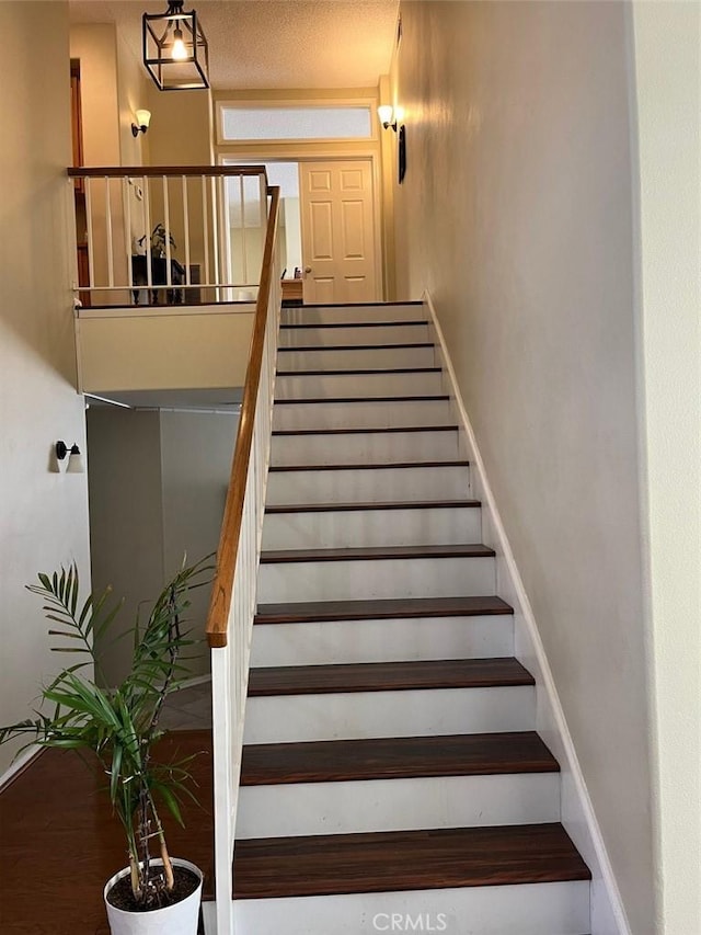 stairway featuring hardwood / wood-style flooring