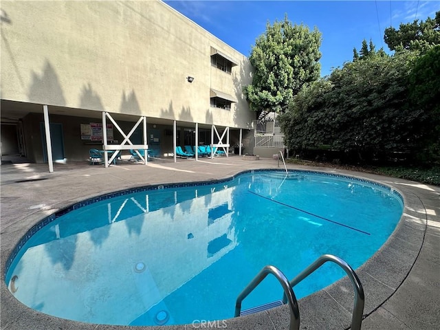 view of pool featuring a patio area