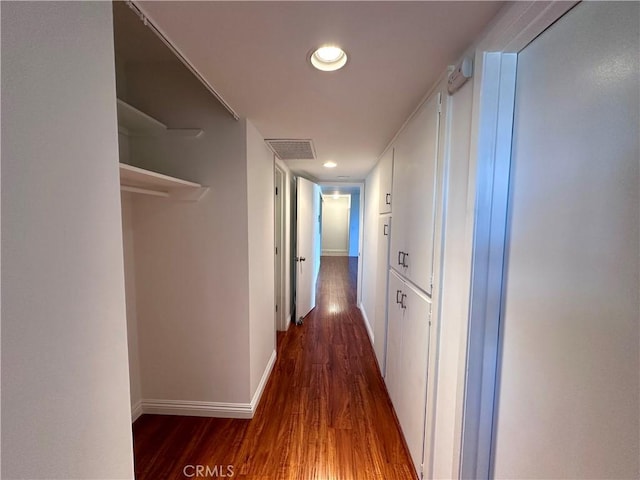 hall with dark hardwood / wood-style flooring