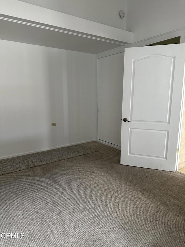 spare room featuring carpet flooring