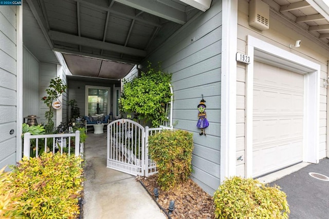 doorway to property featuring a garage