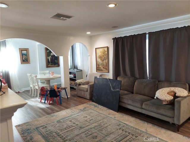 living room featuring dark hardwood / wood-style flooring