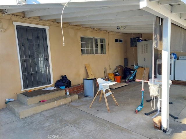 view of patio / terrace featuring separate washer and dryer