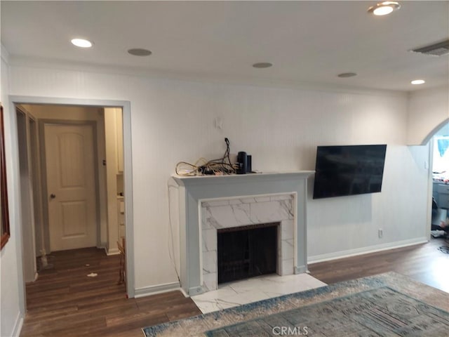 unfurnished living room with hardwood / wood-style flooring and a fireplace